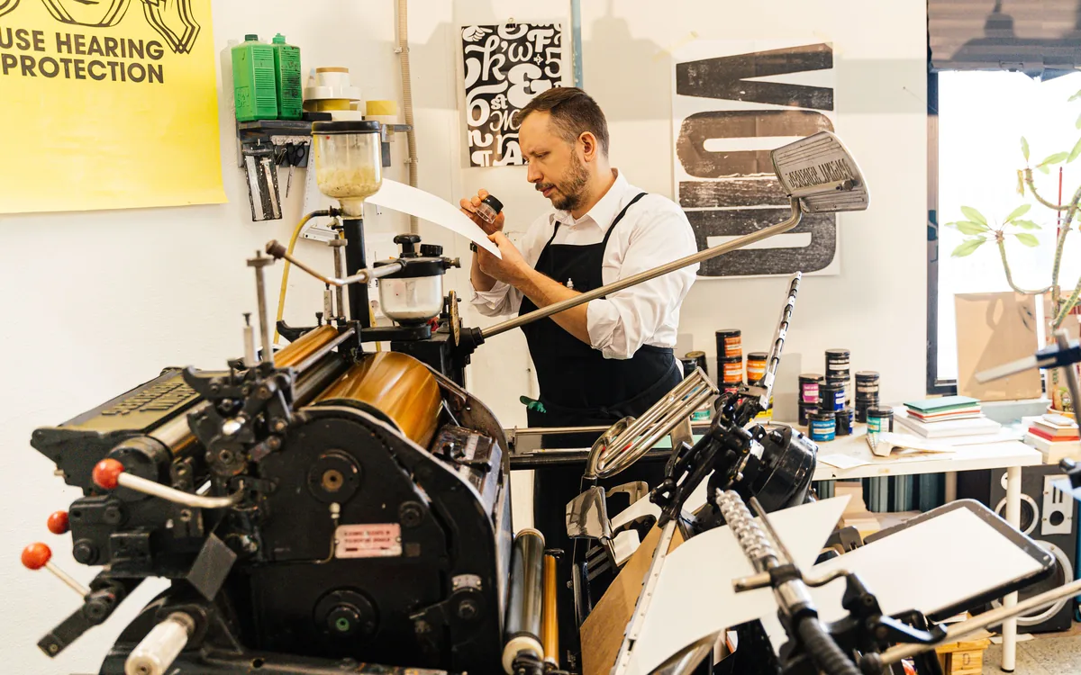 A printer running a press in the studio